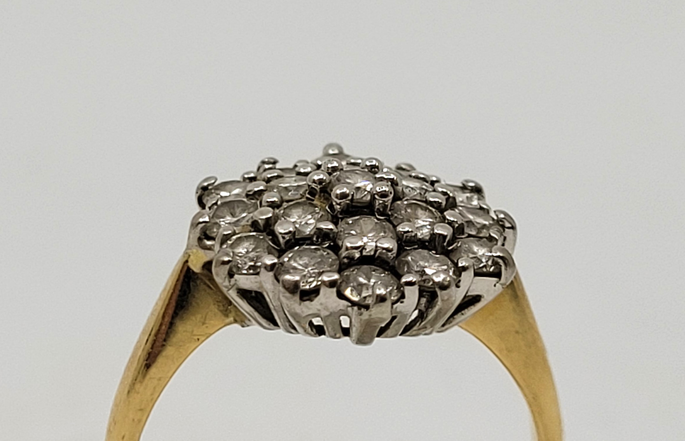 An 18ct. gold diamond cluster ring, having domed hexagonal mount pave set twenty-one round brilliant - Image 9 of 9