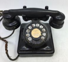 A vintage MFG black bell telephone, (2714 A)
