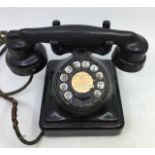 A vintage MFG black bell telephone, (2714 A)