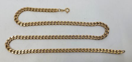 A 9ct. gold flat curb link chain, length 61.5cm. (51.9g)