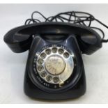 A vintage black bell telephone