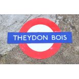 "Theydon Bois", an original three piece enamelled London Underground station sign, length 149cm.