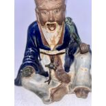 A Chinese 19th cent high fired pottery figure of an elder holding a Ruyi Sceptre  Very good