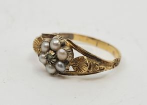 A precious yellow metal pearl and green gemstone ring, claw set mixed light green gemstone (possibly
