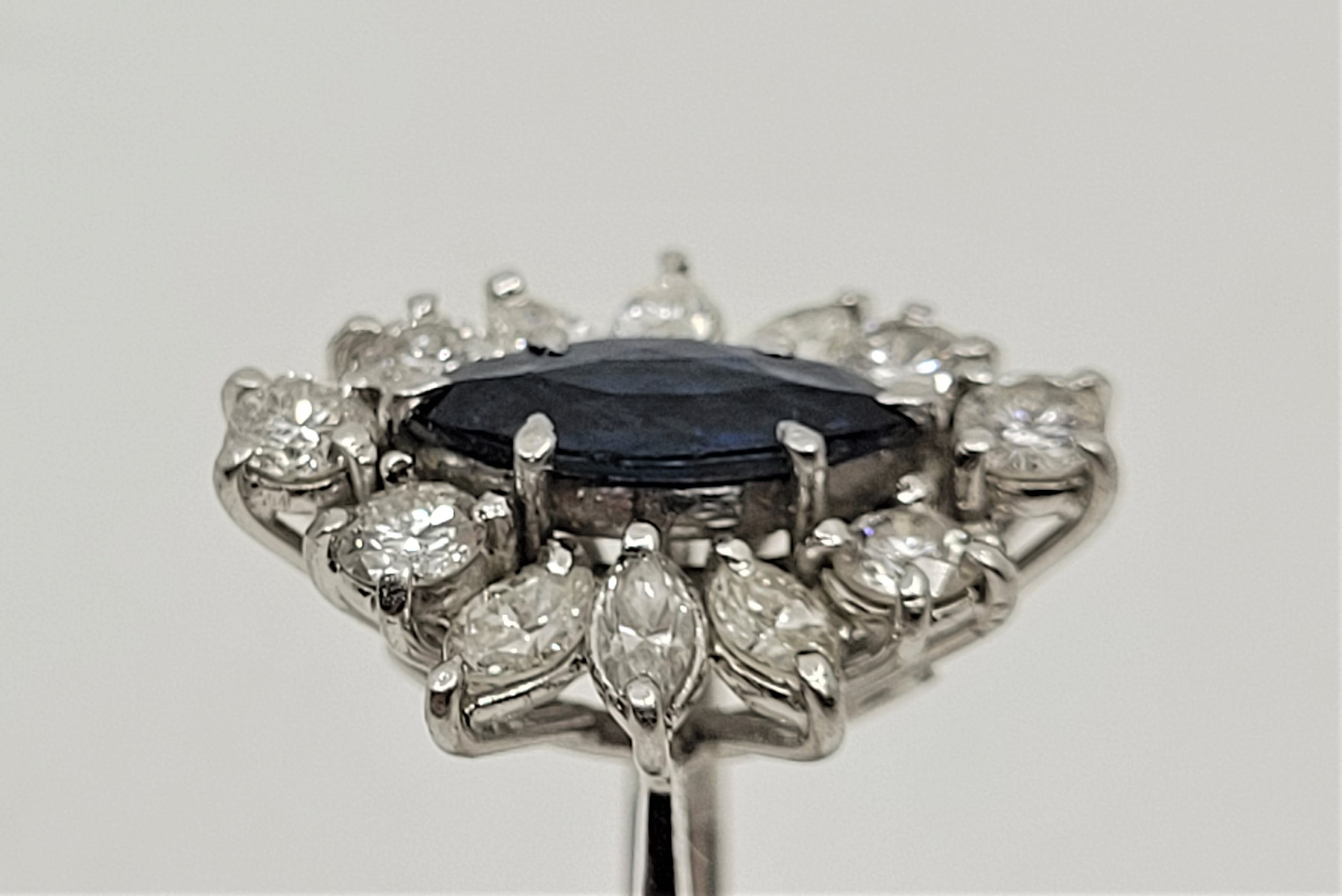 An 18ct. white gold, platinum, sapphire and diamond ring, set marquise cut blue sapphire to centre - Image 4 of 18