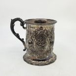 A Victorian silver mug, by Samuel Hayne & Dudley Cater, London 1863, repousse 'C' scrolls and