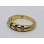 An 18ct. gold and five stone diamond ring, flush set five round brilliant cut diamonds (ETDW 0.35