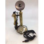 A vintage bronze stick telephone (a/f)