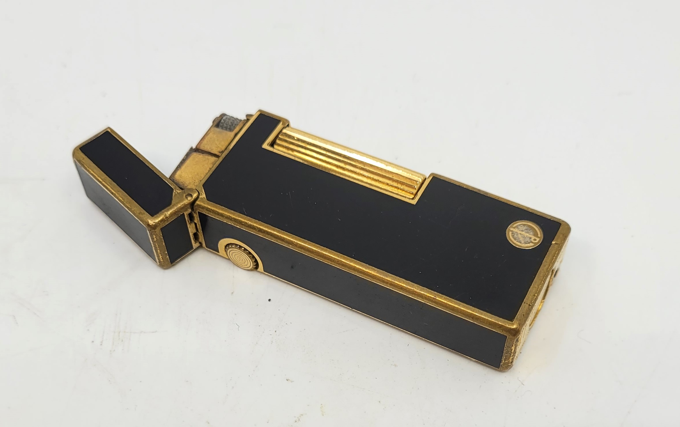 A Dunhill gilt metal and black enamel Rollagas cigarette lighter. - Image 2 of 9