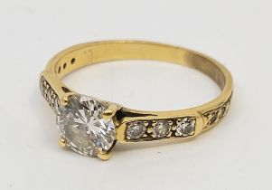 A precious yellow metal and diamond ring, four claw set round brilliant-cut diamond to centre (EDW
