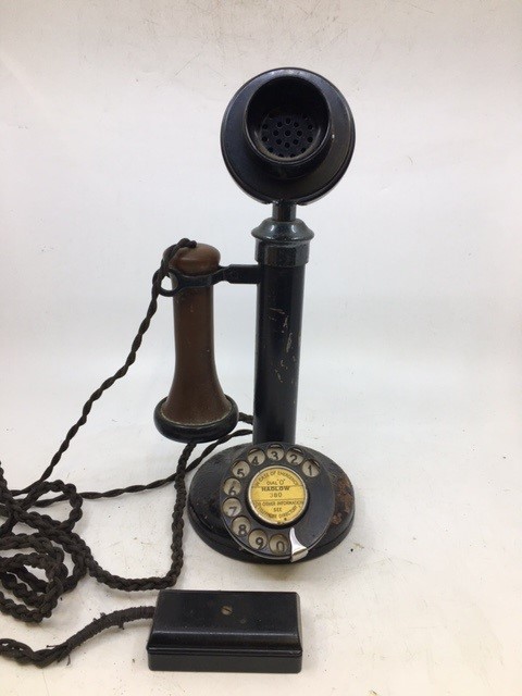 A vintage back stick telephone