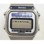 A Seiko A156-5040 Sports 100 solar powered LCD stainless steel wrist watch, c.1979, with Seiko
