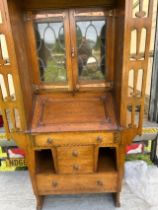 An arts and crafts interest Attributed  Liberty  Oak glazed bookcase