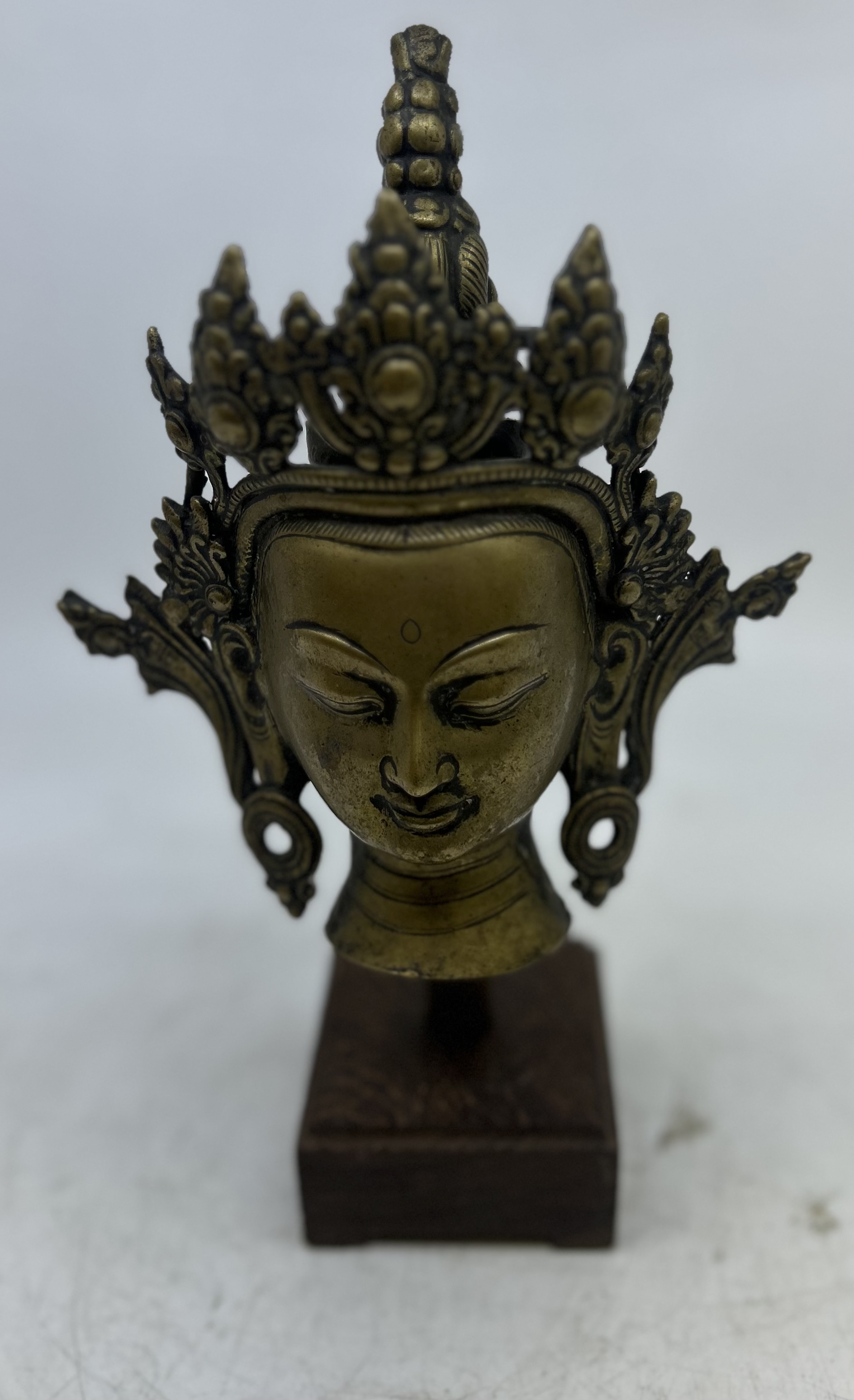 A large 19th cent  bronze head of Vajrasattva later mounted on stand