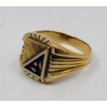 An 18ct. bi-colour gold and enamel signet ring, the stepped rectangular face with textured yellow