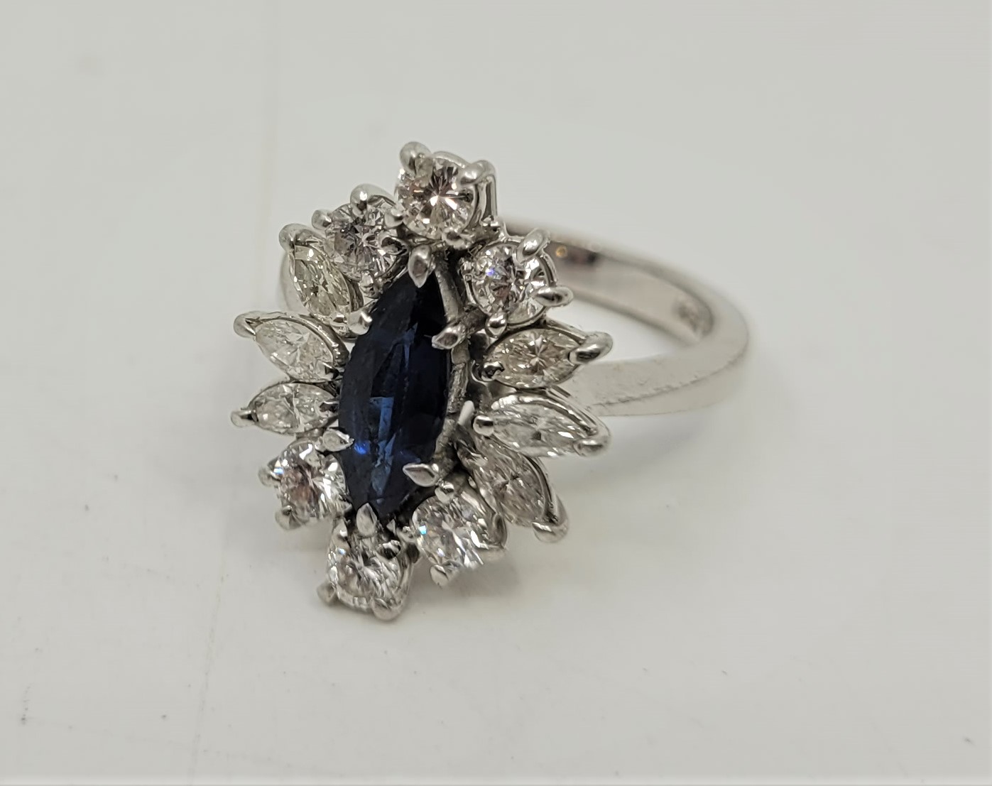 An 18ct. white gold, platinum, sapphire and diamond ring, set marquise cut blue sapphire to centre - Image 13 of 18