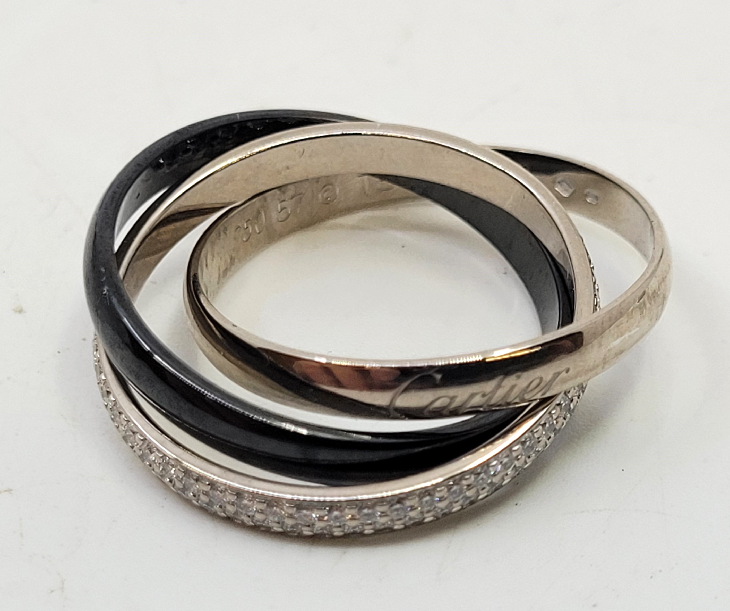 A Cartier 18ct. white gold, black ceramic and 18ct. white gold diamond set trinity ring, the plain - Image 21 of 21
