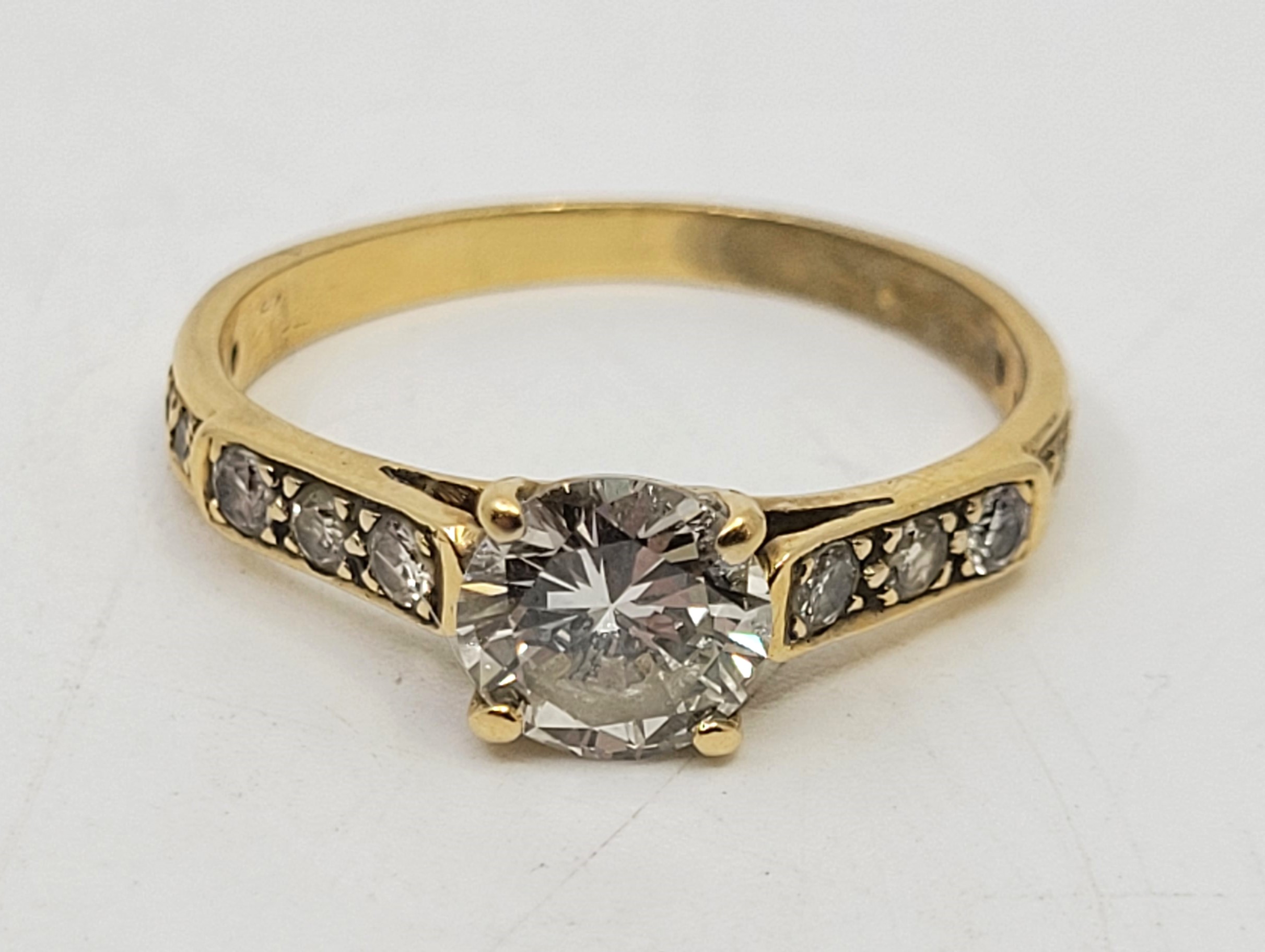 A precious yellow metal and diamond ring, four claw set round brilliant-cut diamond to centre (EDW - Image 2 of 12