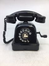 A vintage black bell telephone