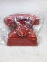 A vintage style red bell telephone