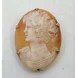 A 9ct. gold mounted cameo brooch, carved with a profile bust of a lady, height 36mm. (gross weight