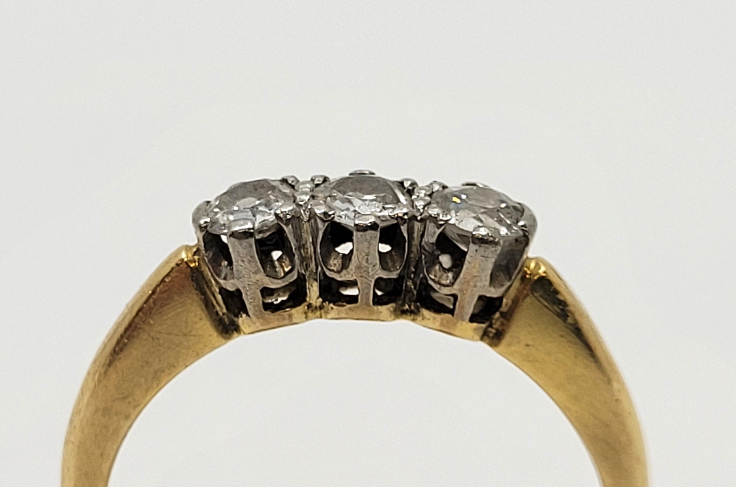 An 18ct. gold and platinum three stone diamond ring, set three round brilliant cut diamonds (ETDW - Image 3 of 9