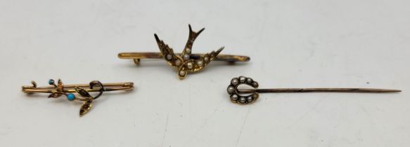 A small collection of yellow metal jewellery, to include; a yellow metal and seed pearl lucky