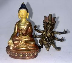 An interesting 18th 19th cent Chinese small bronze deity depicting Mahakala and a small gilt buddha