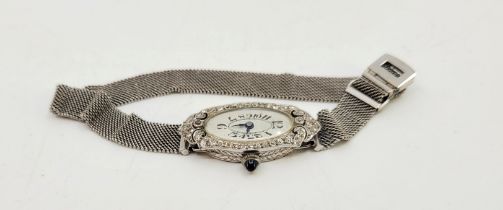 An Art Deco ladies platinum and diamond cocktail watch, manual movement, having oval enamel Arabic