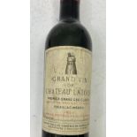 A Demi bottle of Latour 1961 Level good ,  cellar stored ,  some label discolouration.  Further