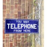 "You May Telephone From Here", an original double sided enamelled sign, 23cm x 55.8cm, with