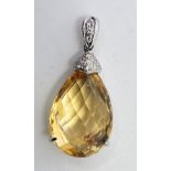 An 18ct. white gold, diamond and citrine pendant, set mixed pear shape cut citrine with white gold