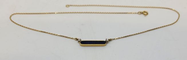 An 18ct. yellow gold lapis lazuli and diamond choker pendant necklace, fashioned as horizontal bar