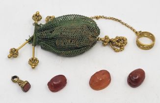 Three various carnelian scarab beetle intaglios/seals, two carved with intaglio of a standing figure