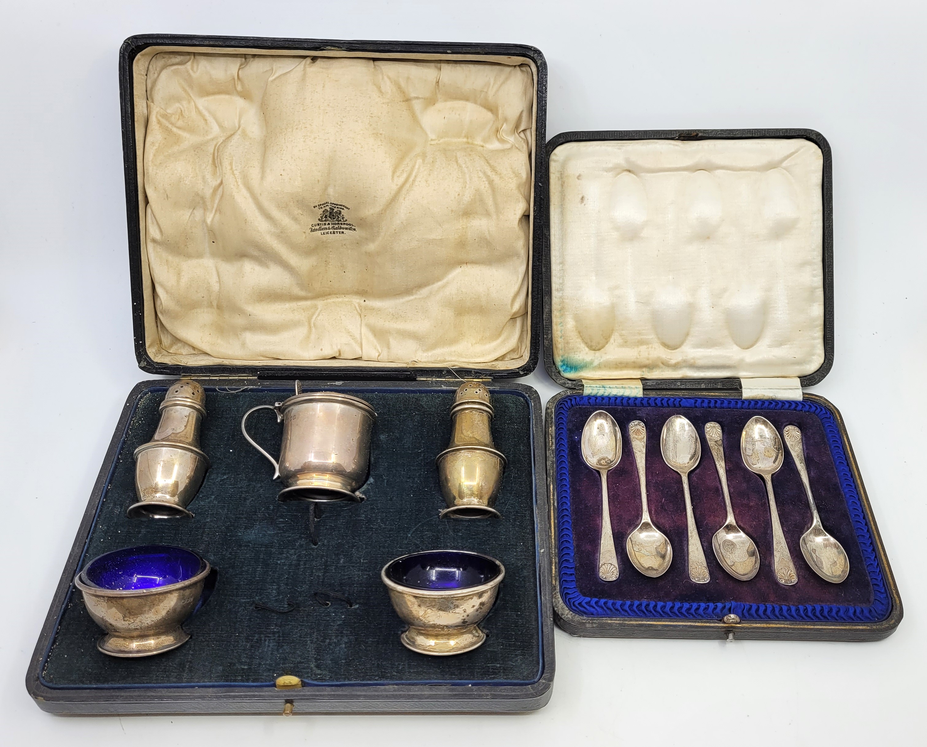 A five piece silver cruet set, by Edward Barnard & Sons Ltd, London 1916, comprising a pair of