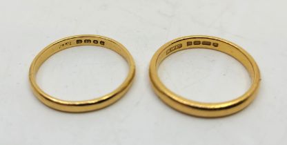 Two 22ct. gold bands, London 1936, size UK N 1/2, and London 1967, size UK P. (total 6.2g). (2)