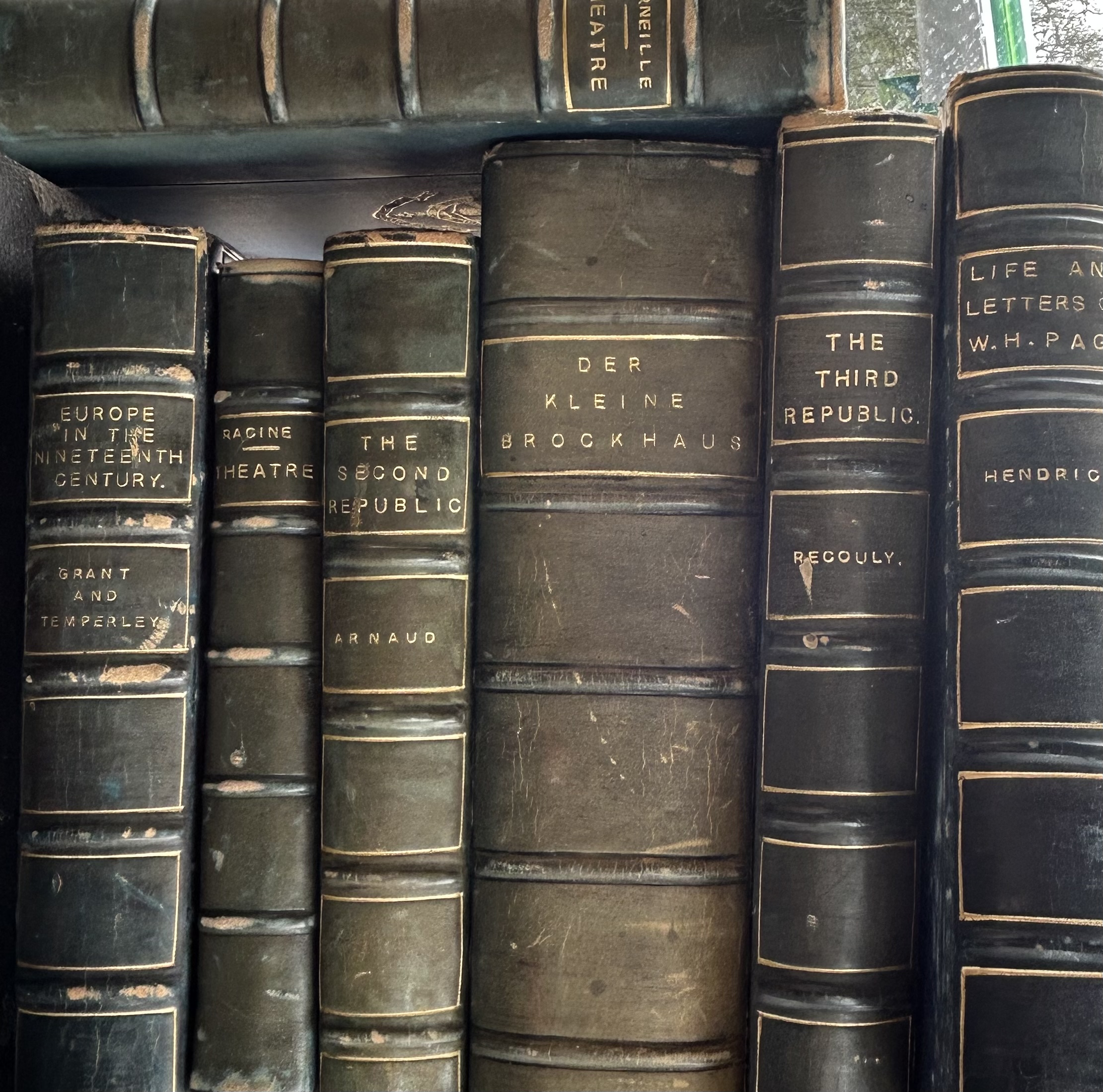 A collection of early 20th cent leather bound books