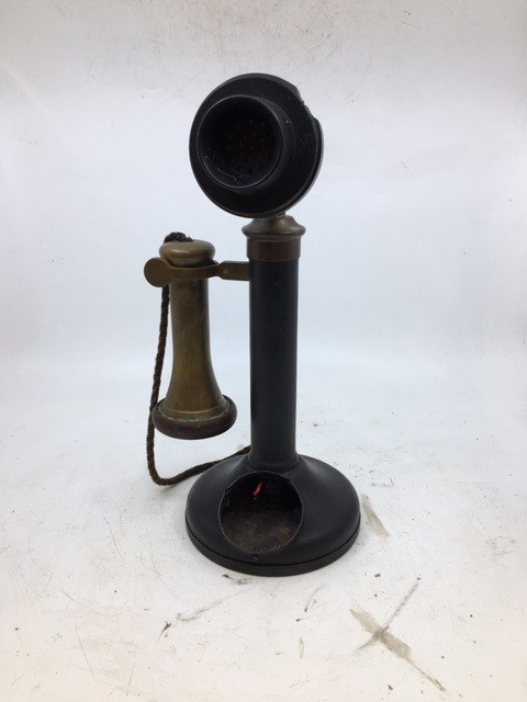 A vintage stick telephone (a/f)