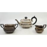 A Victorian silver three piece tea service, by W Spurrier & Co, Birmingham 1897, comprising ebony