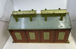 A Tin plate OO Gauge Hornby shed, all Chimney intact missing one door