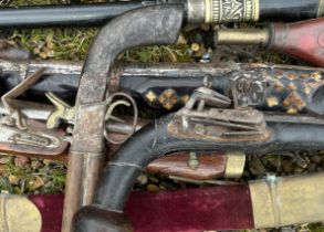 An interesting collection of flintlock guns to include a Kazak Rifle powder flask , sword stick