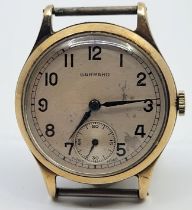 A Garrard 9ct. gold gentleman's presentation wrist watch, having signed circular Arabic numeral dial