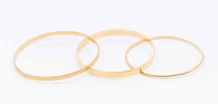 A collection of two 18ct gold bangles stamped 750, weight approx 24.8gms along with a narrow