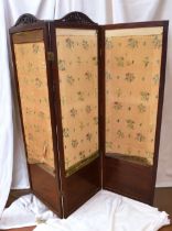 An Edwardian mahogany room screen with fabric panels.