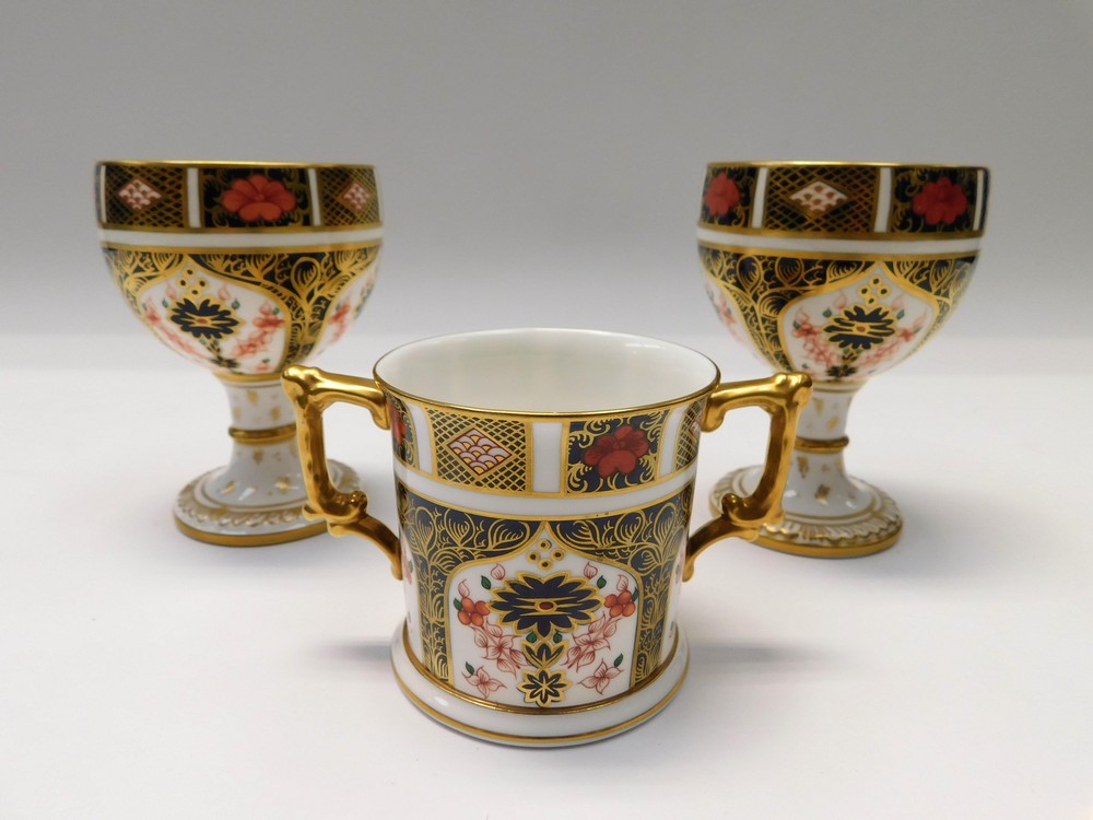 Two Royal Crown Derby 1128 imari goblets along with a 1128 imari twin handles mug, all 1st quality.