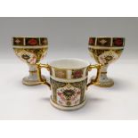 Two Royal Crown Derby 1128 imari goblets along with a 1128 imari twin handles mug, all 1st quality.