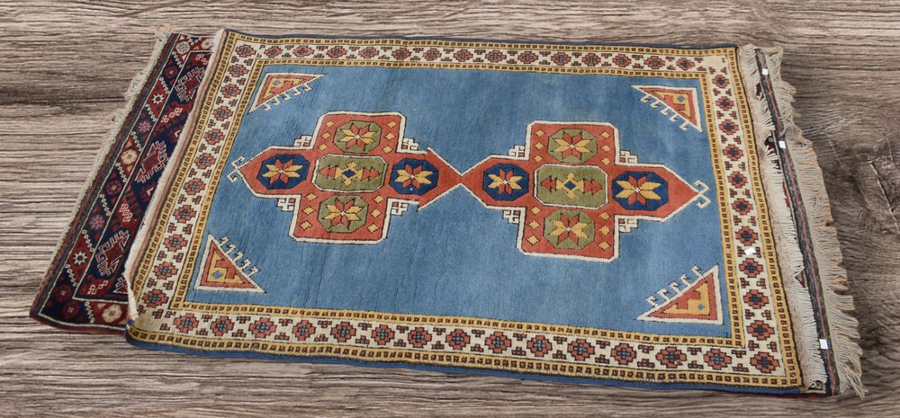 Two thick hand knotted mid 20th Century Persian rugs, central regions, deep reds and light blue