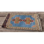 Two thick hand knotted mid 20th Century Persian rugs, central regions, deep reds and light blue