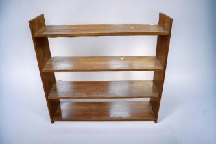 An African hardwood open bookcase made in Ghana (1960s) with peg joints along with an oak top book