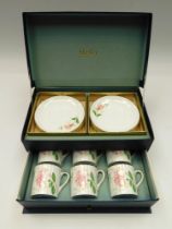 Shelley - a boxed set of six coffee cups and saucers, in floral designed, green marks to bases, in